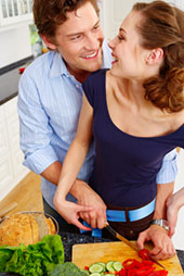 Young couple in the kitchen of their new home