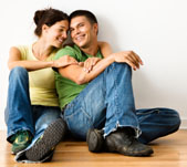 Smiling couple in their new home